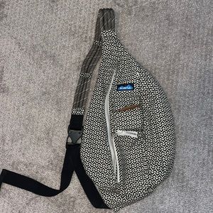 One shoulder Kavu bag for hiking with black and cream herringbone pattern